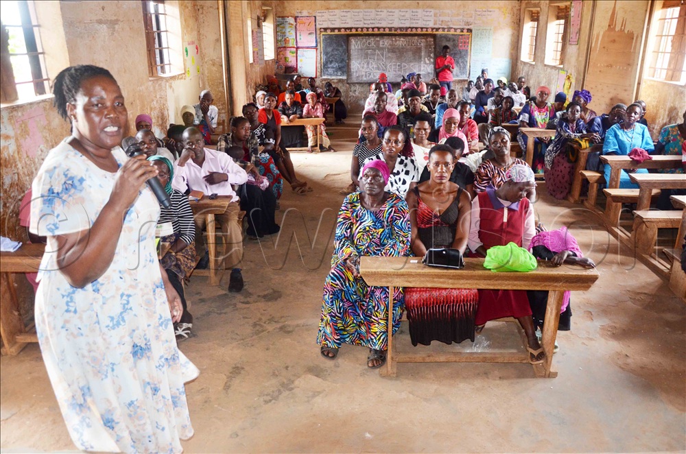 Christine Asire from the International Justice Mission [IJM] addressing some of the residents of Bakka village who turned up for the sensitisation meeting