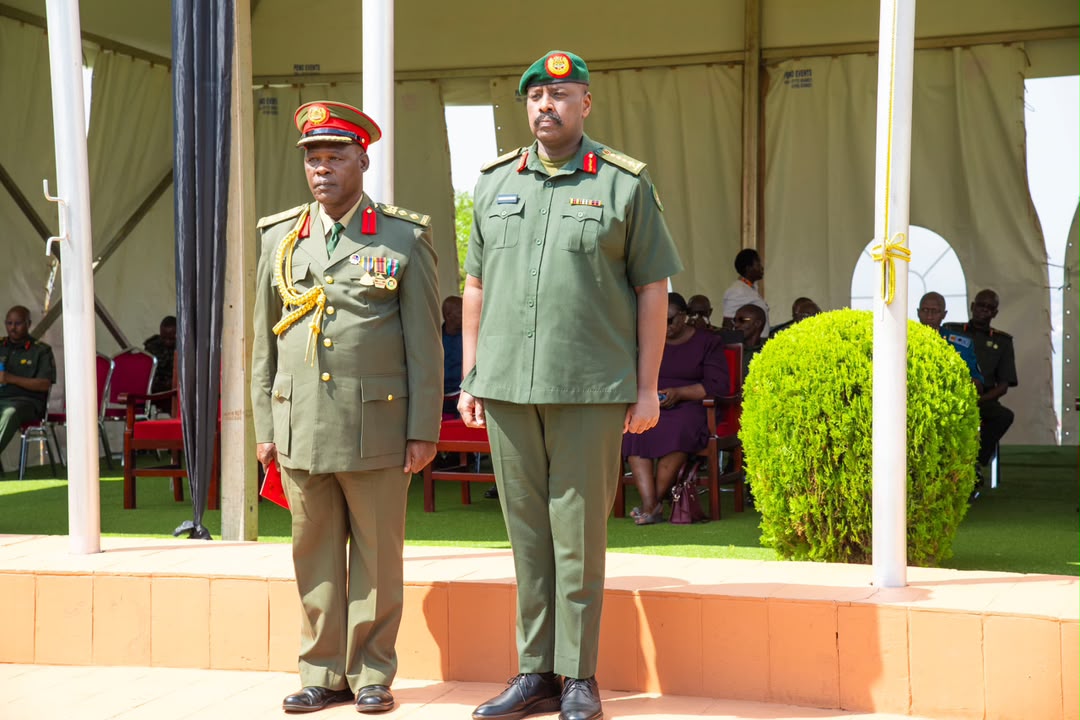 CDF Gen. Muhoozi Kainerugaba with one of the 222 senior officers during the discharge ceremony at the UPDF Joint Services Headquarters in Mbuya on August 12, 2026. (Courtesy)