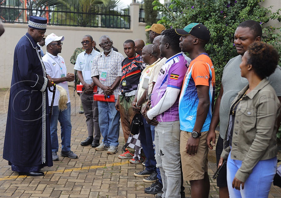 The King of Bugisu Umukuka Jude Mike Mudoma inspects rally drivers at the offcial flga off the the autocross. PHOTO: Johnson Were