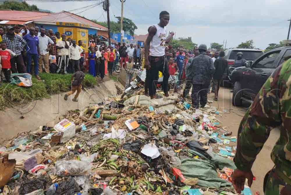The vendors at Karugutu Market complained that despite paying taxes, the district does not collect garbage from the market. (Credit: Lawrence Mulondo)
