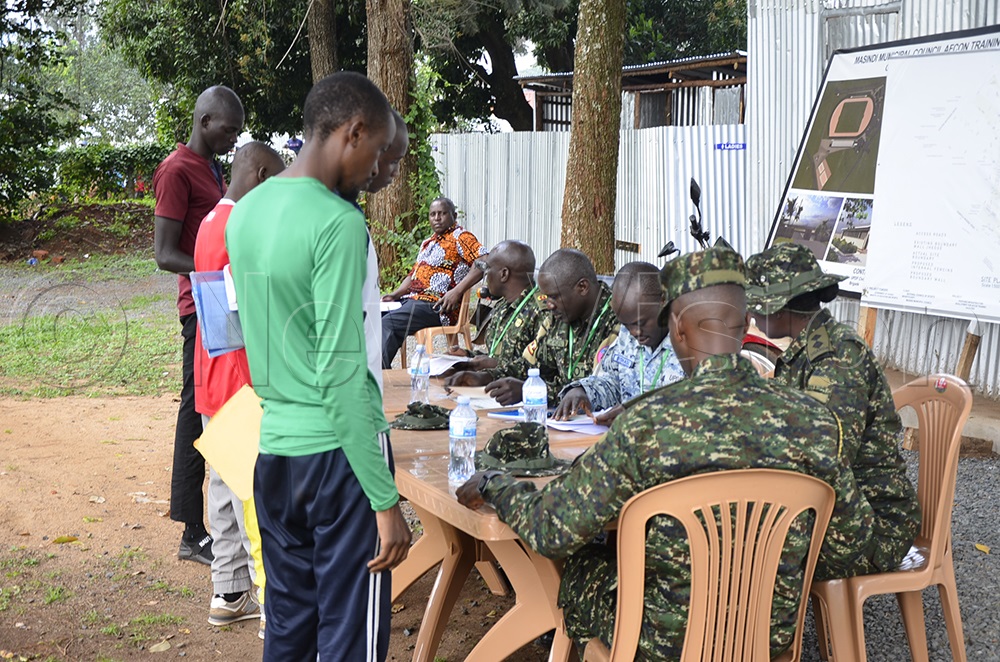 Recruits undergo verification during the UPDF recruitment exercise. (Credit: Yosam Gucwaki)
