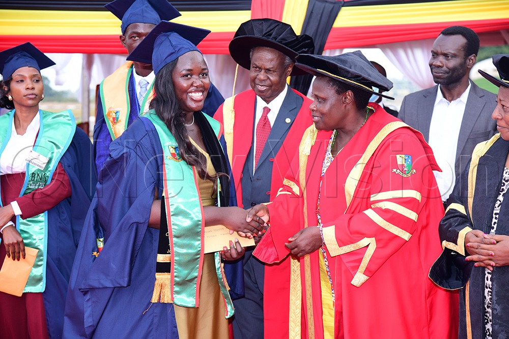 Vice President Jessica Alupo awards one of the outstanding graduates during Soroti University of Science and Technology&rsquo;s inaugural graduation ceremony held last year. (Credit: Godfrey Ojore)