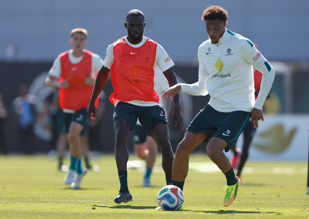 Jason Geria #6 of Australia watches as Tete Yengi #26 passes the ball during a training session ahead of FIFA World Cup 2026 at Oakland Roots and Soul Sports Club on June 03, 2026 in Alameda, California.