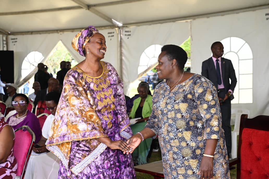 Vice-President Jessica Alupo greeted by one of the mourners during the final send-off of Kazoora's son, Mathew Richard Rubahama Kazzora. (Courtesy)