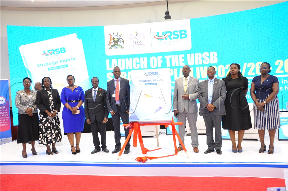 Jackie Kemigisha Kizza Board member URSB, Ann Ninkijuka board member URSB, Mercy Kainobwisho Registrar General Uganda Registration Services Bureau (URSB), Francis Butagira Chairperson Board of Directors Uganda Registration Services Bureau (URSB), Moses Kaggwa Director Economic affairs Ministry of Finance and other officials pose for a group during the launch of the URSB Strategic Plan 1V at the URSB offices Kololo on September 25, 2025. 