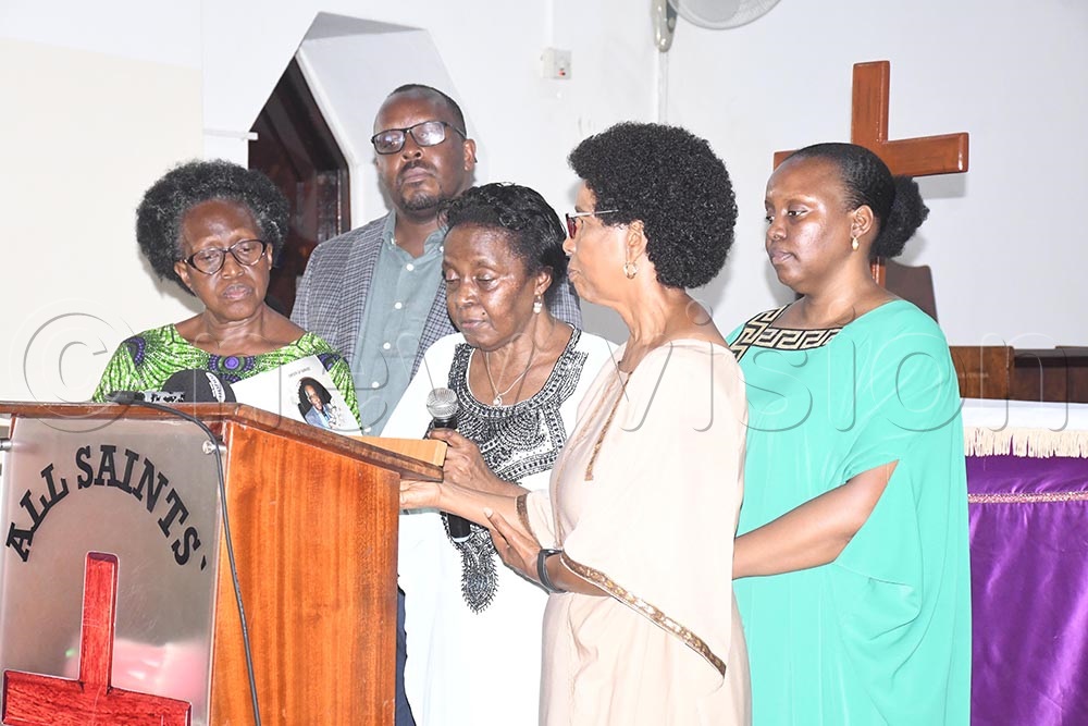 The widow, Dr Peace Musinguzi and family members gives her eulogy about her husband, James Garuga, during a prayer service at All Saints Church, Nakasero in Kampala. (Credit: Isaac Nuwagaba)