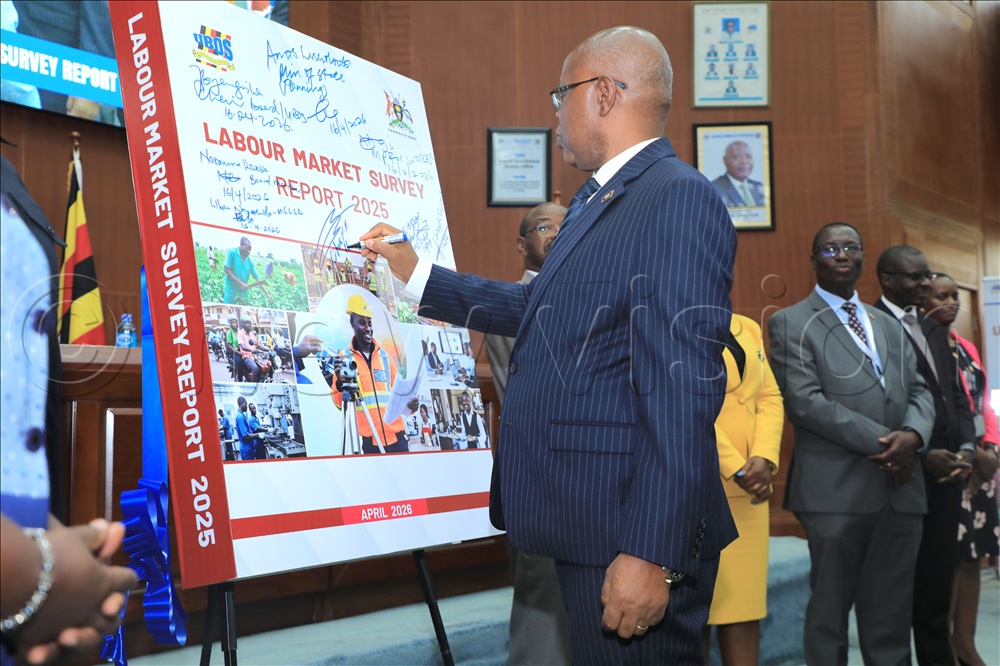 Chris Mukiza Executive Director UBOS signing on the dummy report. This was during the launch of the labour market survey report at Uganda Bureau Of Statistics(UBOS) offices Kampala on April 16, 2026. 