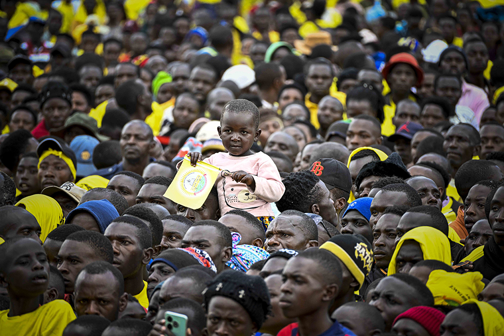 A child amidst the crowd of NRM supporters listening to President Museveni at the campaign rally in Rubanda. (PPU)
