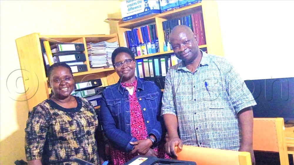 Left to right: Associate Professor Atcero, Ayikoru (centre) and Professor Bada