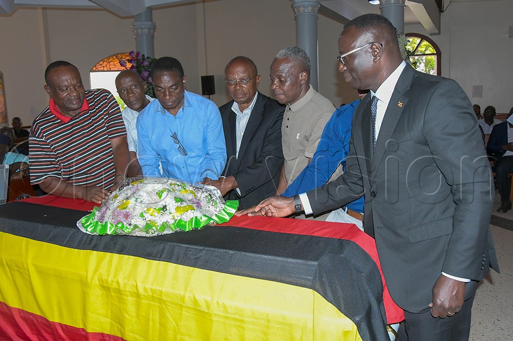 Some of the Lugogo Veterans team players laying a wreath on a casket containing the body of the late Polly Ouma at St. Johns Chapel at Mengo SS Jan 2, 2026. (Photo: Silvano Kibuuka)