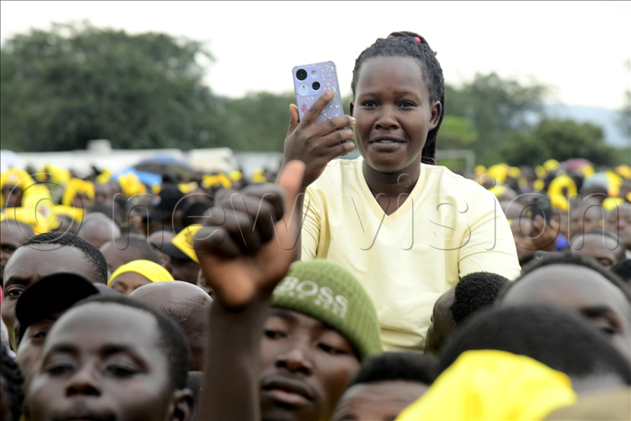 An NRM supporter captures President Museveni as he arrived with the First Lady for their mega rally at Kyamate Primary School playground in Ntungamo district.