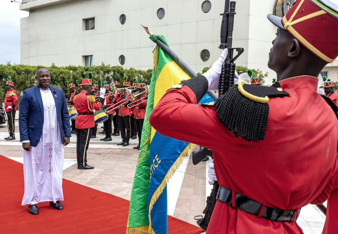 Kaliisa receiving a guard of honour at State House in Librevilleon September 15, 2025. (Credit: MoFA photo)