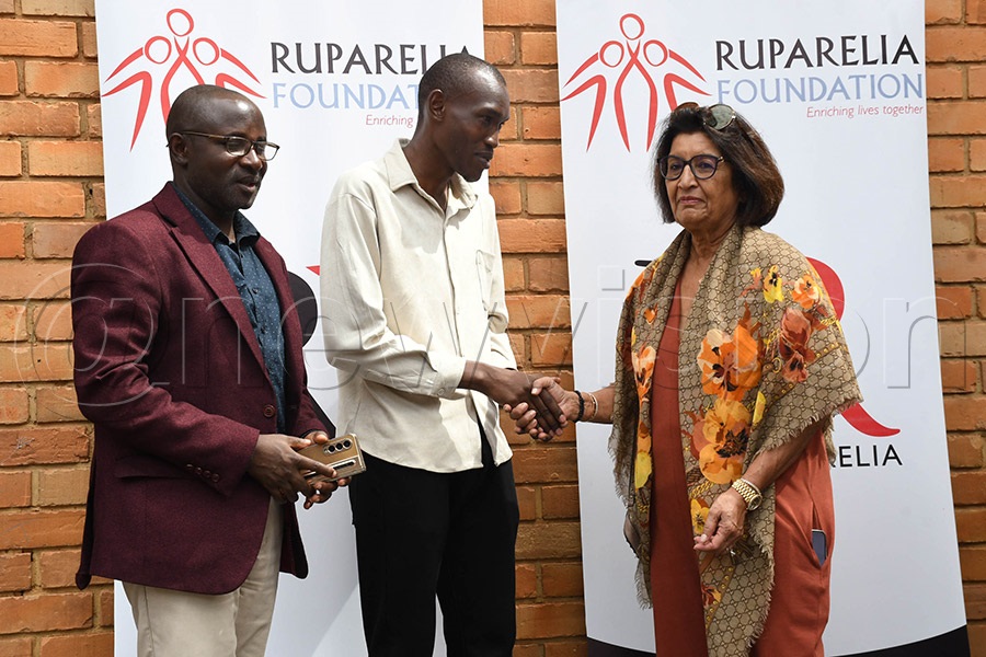 Jyotsna Ruparelia (right) chats with Reagan Egulwa (centre) and Linus Wamanya before the start of the Ruparelia Foundation National Bridge League at Kampala Parents School. Photo by Michael Nsubuga