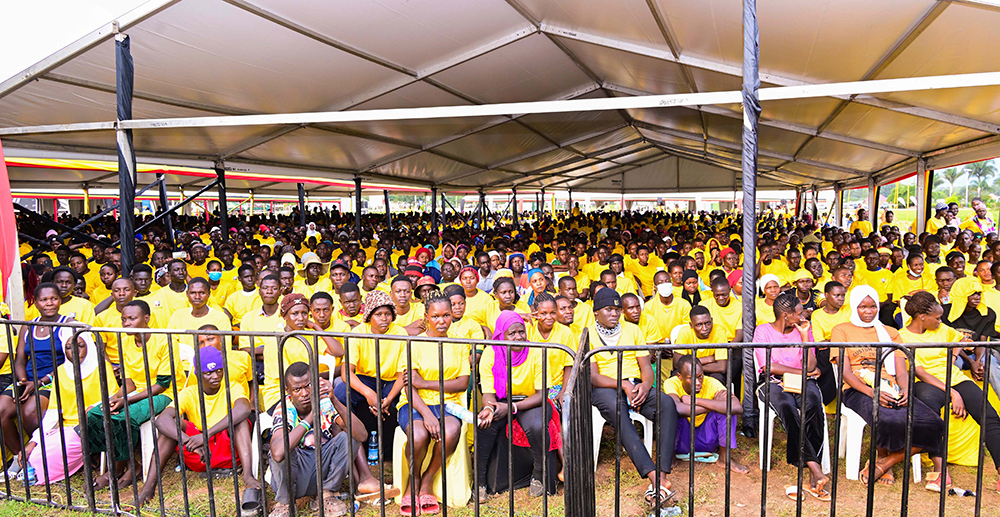 Some of the workers at Sino Mbale Industrial Park listening to President Museveni's address on Friday. (PPU Photo)