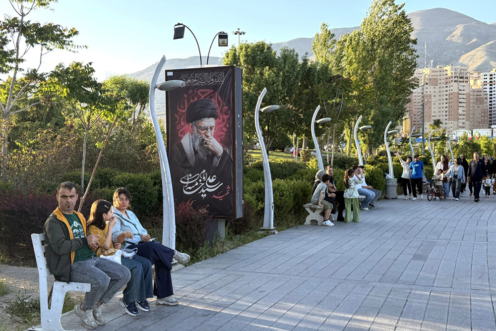 A banner reading &ldquo;Martyr Ayatollah Ali Khamenei&rdquo; is displayed along the walkway at Chitgar Lake, an artificial recreational lake and park officially known as the Lake of the Martyrs of the Persian Gulf, in northwestern Tehran on April 26, 2026. 