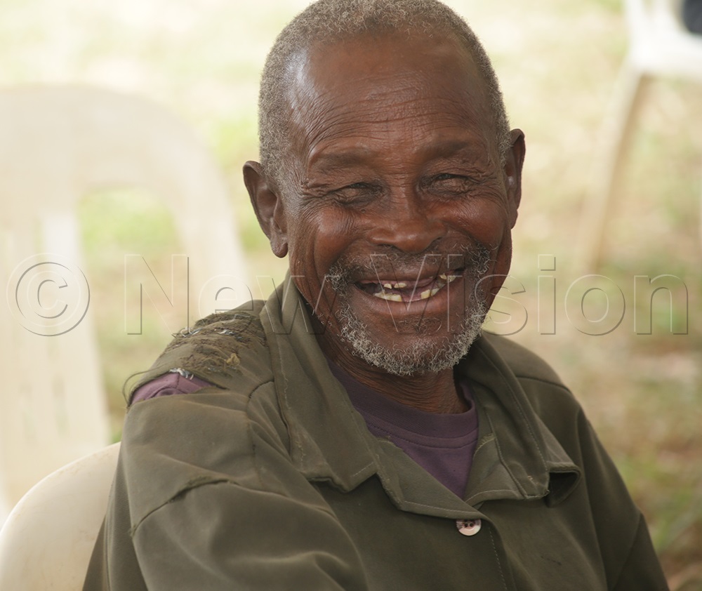 Alexander Emwamu, one of the elderly persons working together in unity to create safe places for the older persons in Teso, smiles during an interview. (Photo by Javier Silas Omagor)