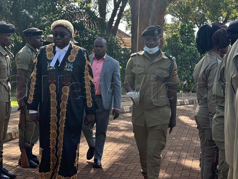 Justice Godfrey Kiryabwire the lead judge at the court of appeal inspecting the guard of honor at the Jinja zonal court. (Credit: Doreen Musingo)