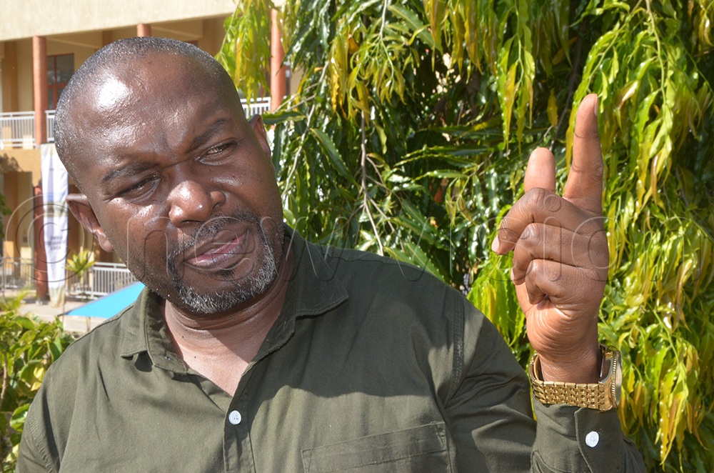 Assistant Commissioner Denis Mulongo Maholo in charge of animal nutrition during the crosss-border meetng in Moroto.  (Credit: Olandason Wanyama)