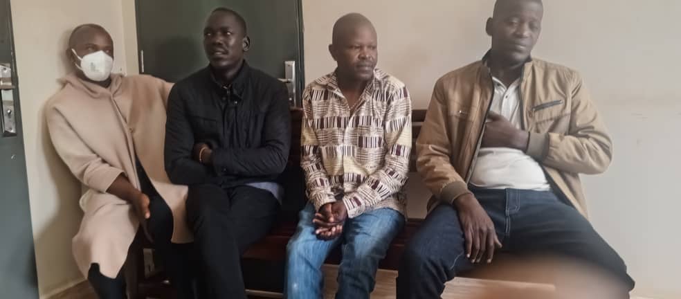 John Baptist Mwesigye (With a white mask), Godfrey Kyandiga (one in black), Mugisha Savino (one with a follow-up shirt) and Robert Ssebunya after being arrested in Buhweju. (Courtesy)