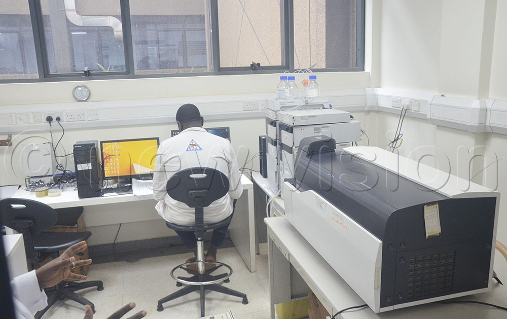 A UNBS laboratory analyst in one of the institution's laboratories where different product samples are taken for quality testing. (Credit: Douglas Mubiru) 
