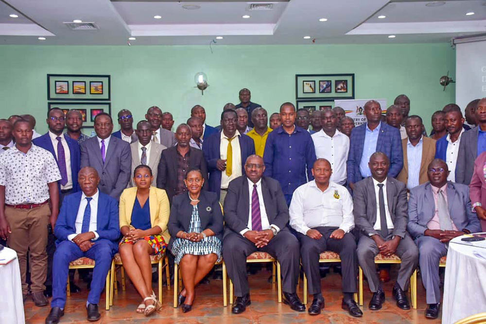 Ben Kumumanya (Centre seated), the permanent secretary of the ministry of local government and local government officials pose for a photo after the meeting. (Photo by John Odyek)