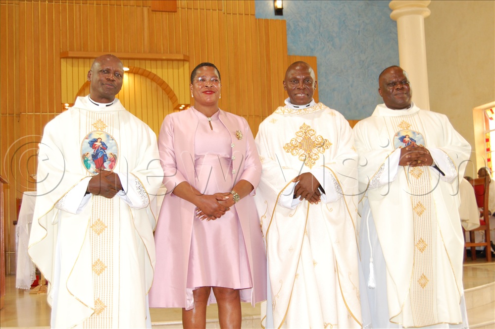 The priestly silver jubilarians:  Fr.Kizito Kiyimba (left), Fr.  Edward Muwanga (third-left), and  Fr. Joseph Kirumira (right) share a photo moment with the Speaker of the Parliament of Uganda, the Rt. Hon. Anita Annet Among after their thanksgiving mass at St. Charles Lwanga Catholic parish church, Ntinda, in Nakawa Division on Saturday, September 6, 2025. 