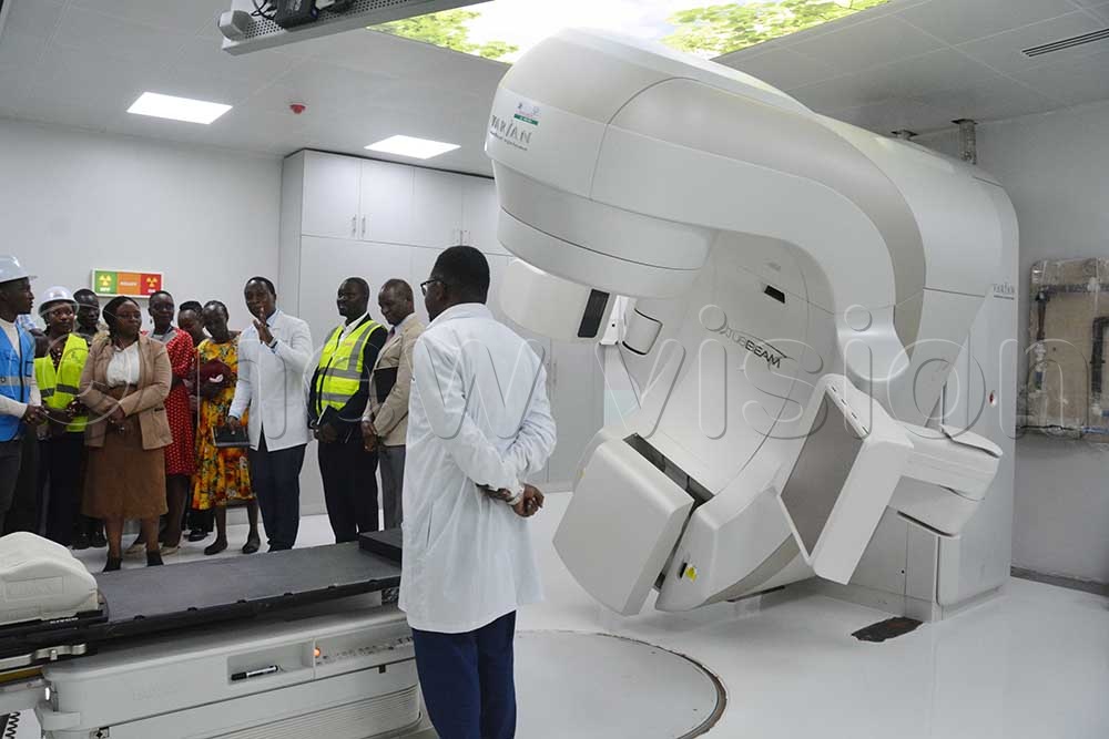 The chairperson of Uganda Cancer Institute board, Prof. Damalie Nakanjako (third left), with Dr Solomon Kibuude (centre), Dr Godfrey Osinde (third right), the executive director of UCI, Dr Jackson Orem (second right) and other officials inspecting the radiotherapy machine at Mulago Hospital on April 14, 2026. (Credit: Francis Emorut)