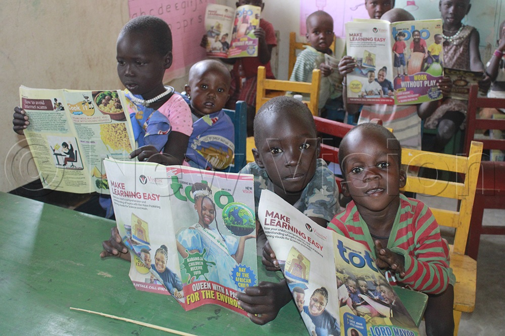Pupils eagerly look forward to receiving Toto Magazine every week. (Credit: Ritah Mukasa)
