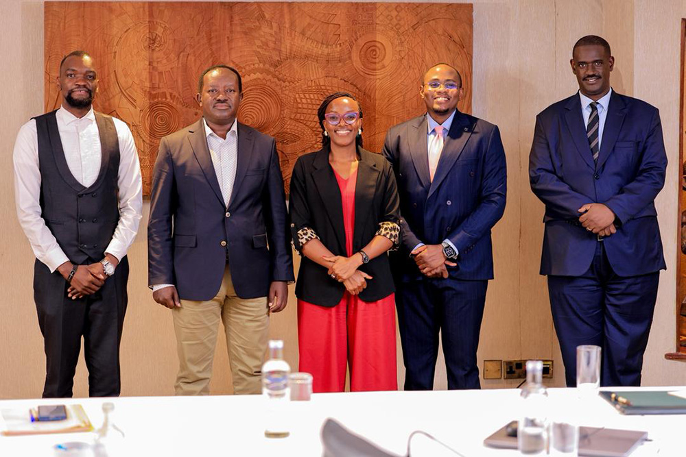 The chairperson of the Parliamentary Committee on Defence and Internal Affairs, Wilson Kajwengye (2L) and Elison Karuhanga (R) pose for a photo with part of the team behind the Judicial Service Conversations. (Courtesy photo)