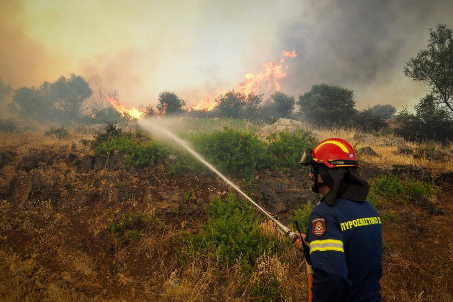 A firefighter battles the flames in Drosopigi, East Attica region of Greece, July 26, 2025. (Photo by krioneri tatiana bolari/Xinhua)