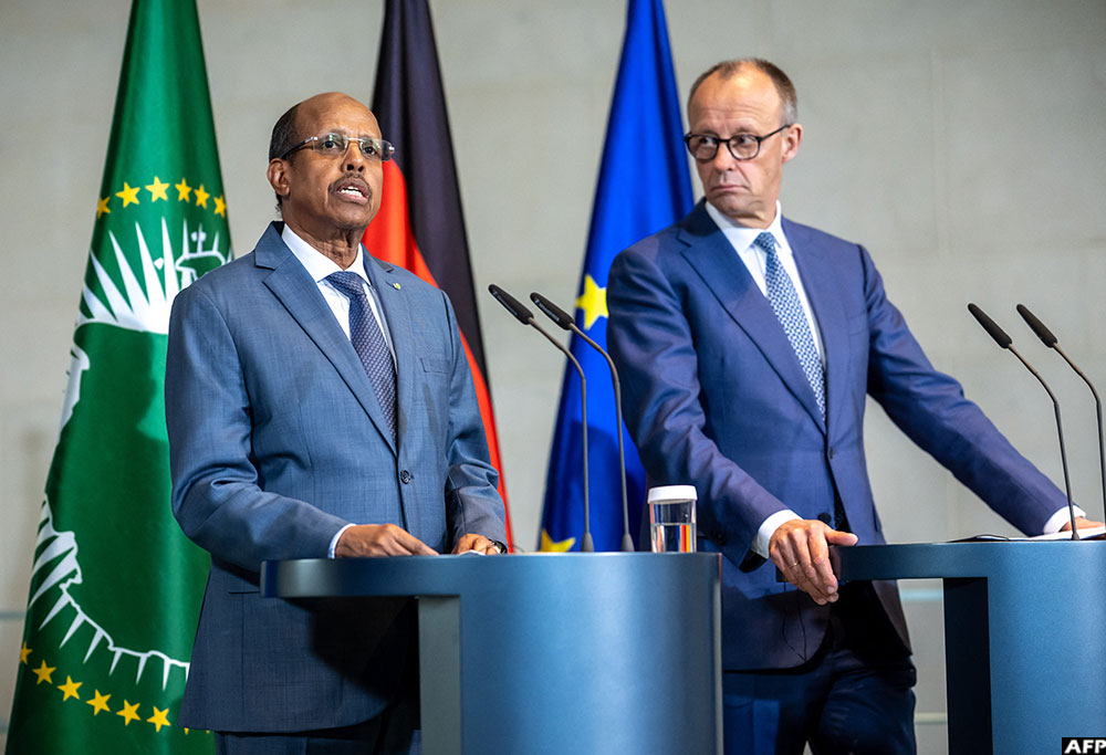 African Union Commission Chairman Mahamoud Ali Youssouf (L), in Berlin for the meeting, has voiced hope for a cessation of hostilities in Sudan.