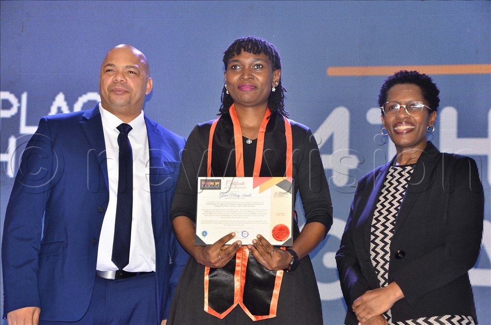 Grace Mary Amule (centre) poses for a photo as Malcolm Fielles (left), Regional Director of ICF, Europe and Africa and Joan Mugenzi (right), head coach look on during Imagine Me Africa coaching programme launch at Sheraton Hotel in Kampala on May 14, 2026. 