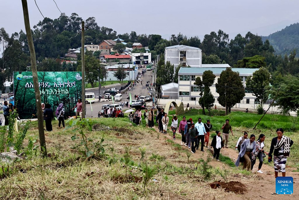 People take part in a nationwide tree-planting campaign in Addis Ababa, the capital of Ethiopia, Aug. 3, 2026. (Xinhua/Geng Xinning)