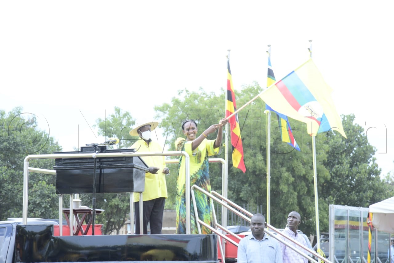 Hon. Phiona Nyamutoro waving NRM flag given by President Museveni.