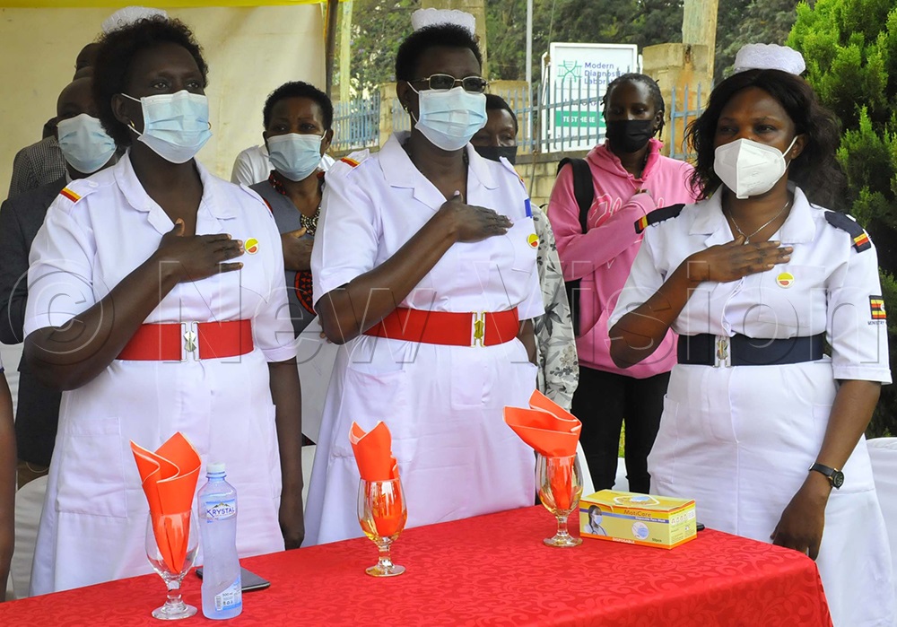Medics sing the women’s anthem at Uganda Nurses and Midwives Union (UNMU head offices at Mulago. (Photo by Wilfred Sanya)