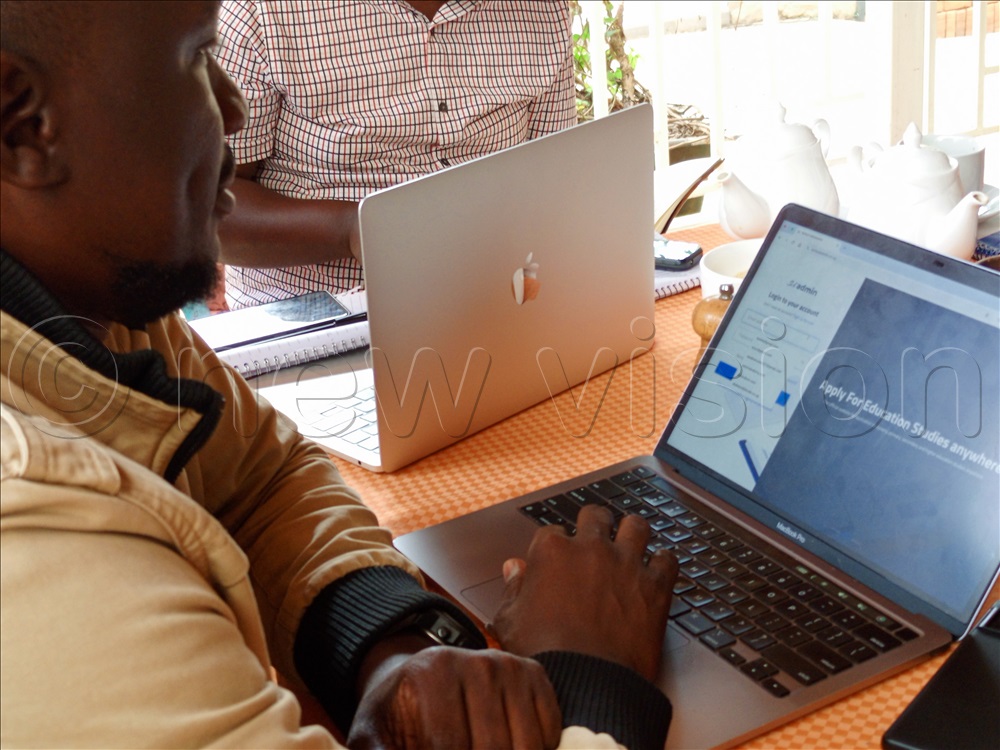  A man demonstrates how the web-based portal SchoolAdmin.co works. Ugandan innovators say that while some tech solutions have succeeded, many equally promising projects stall at the Minimum Viable Product (MVP) stage due to limited  support.