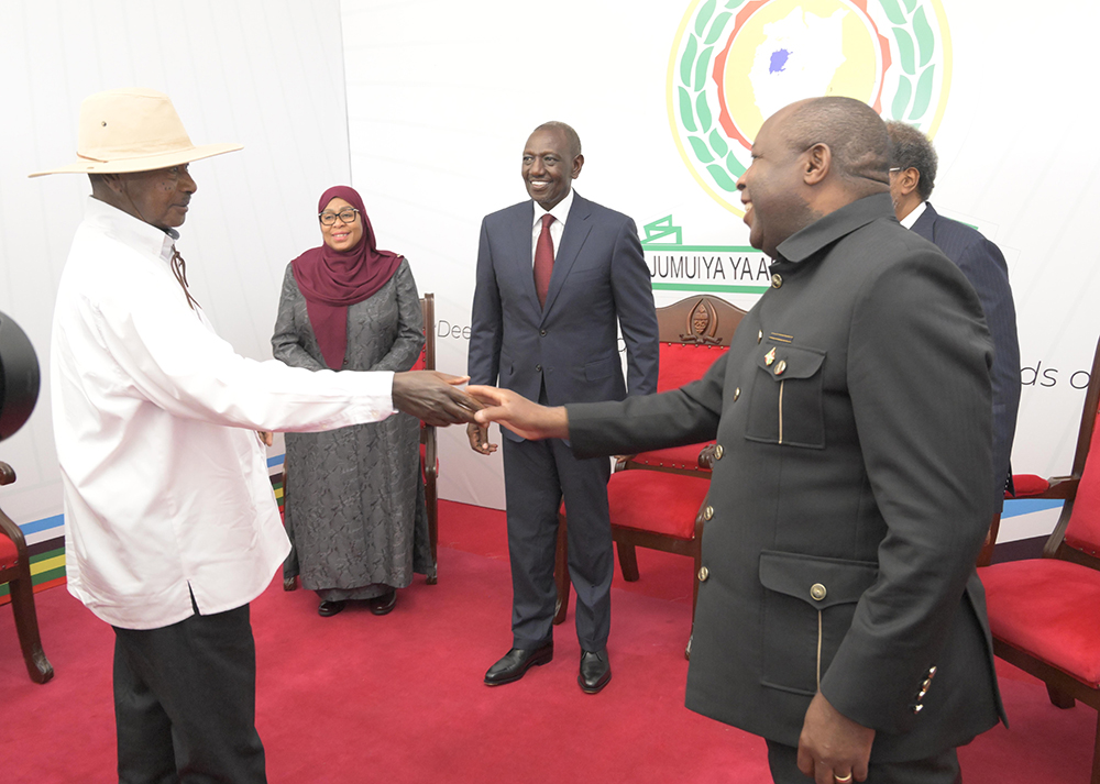President Museveni greeting President &Eacute;variste Ndayishimiye of Burundi.
