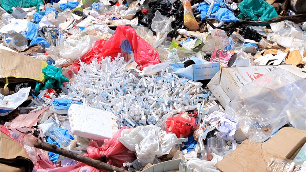 Medical waste openly dumped at the site posing a danger to the garbage scavengers.