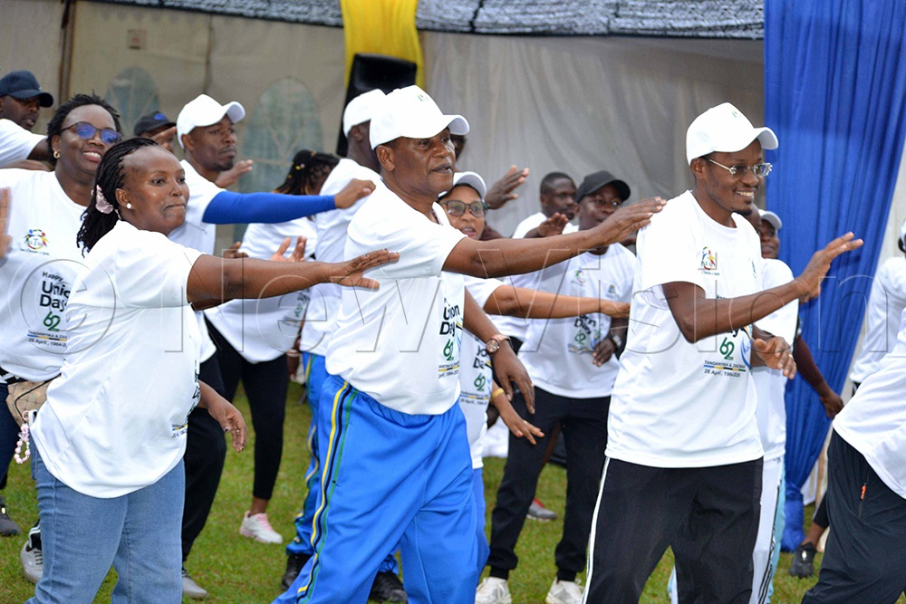 Maj. Gen. Paul Kisesa Simuli (centre), the High Commissioner of the United Republic of Tanzania in Uganda, is doing exercises with Tanzanians living in Uganda during the country&rsquo;s Union Day. (Photo By Jovita Mirembe)