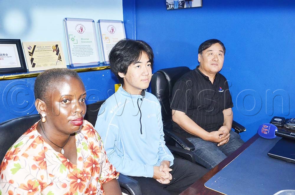 The administrator Eric Wang Foundation, Dorah Nakirya, Patron David Wang and Director Eric Wang addressing the press at Simbaland Cargo Holdings offices at Ham Building. (Credit: Isaac Nuwagaba)