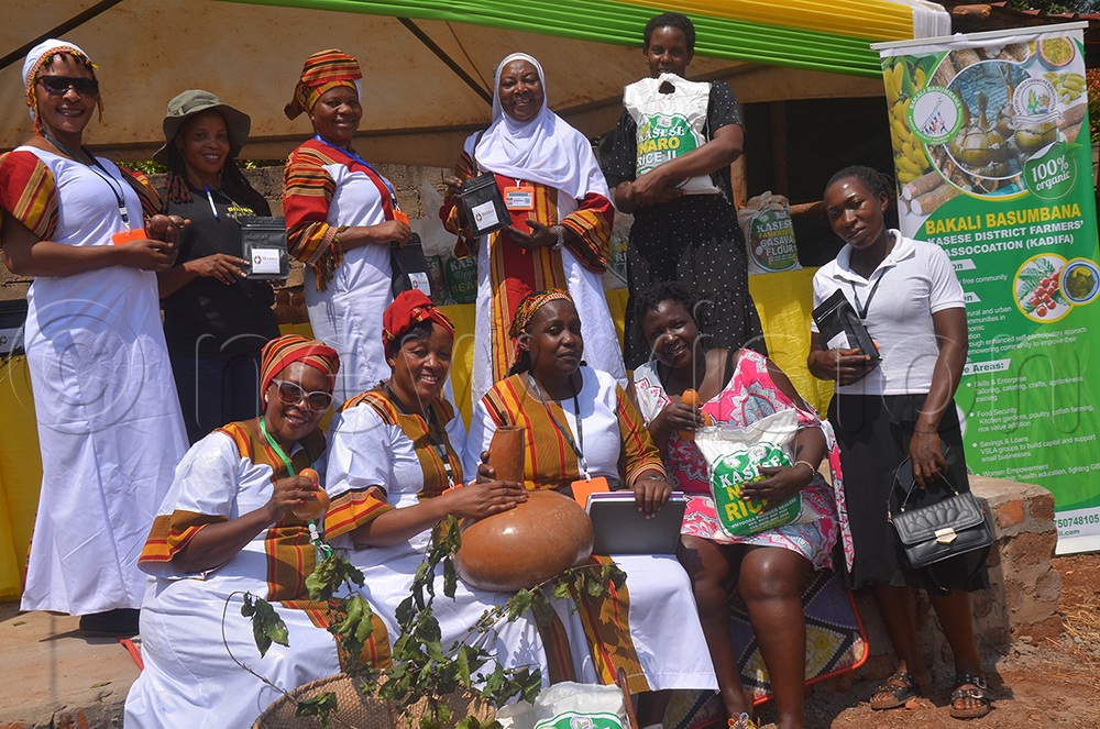  A section of women farmers under their group, code-named Bakali Basumbana affiliated Kasese farmers Association exhibit their products at the National Agricultural Show in Jinja City. (Credit: Samuel Amanyire)