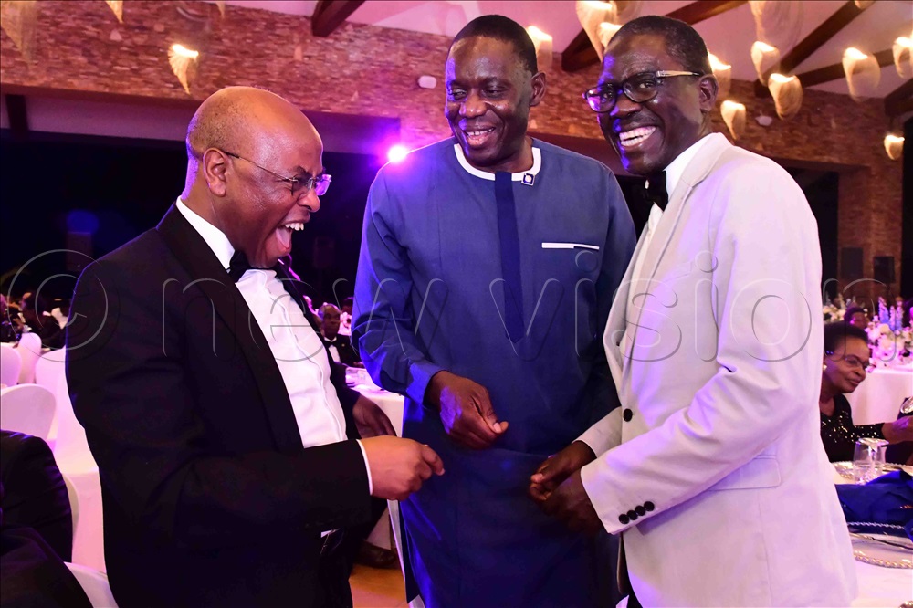  Felix Osike, the New Vision deputy editor in chief and a member of the Rotary International communications committee (right), having a light moment with the Bank of Uganda governor, Michael Atingi-Ego (M) and his deputy, Prof. August Nuwagaba.