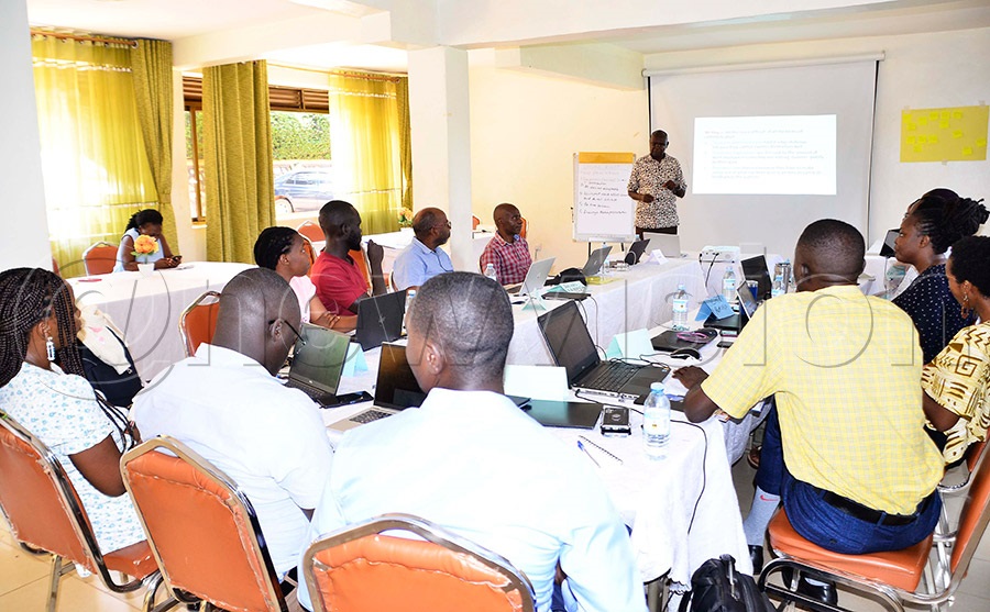 Prof. Joseph Obua, a Makerere University facilitator, addressing researchers during a workshop. Photo by Juliet Kasirye