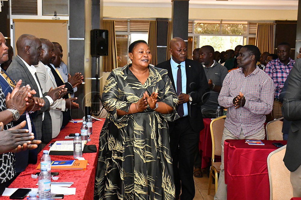 The Minister for Presidency, Milly Babirye Babalanda (middle), arriving at the Source of the Nile Hotel in Jinja City to close the RDCs workshop on August 19th. 2nd right is the RDCs' Whip in Busoga sub-region and also Bugiri RDC Richard Gulume. (Photo by Donald Kiirya)