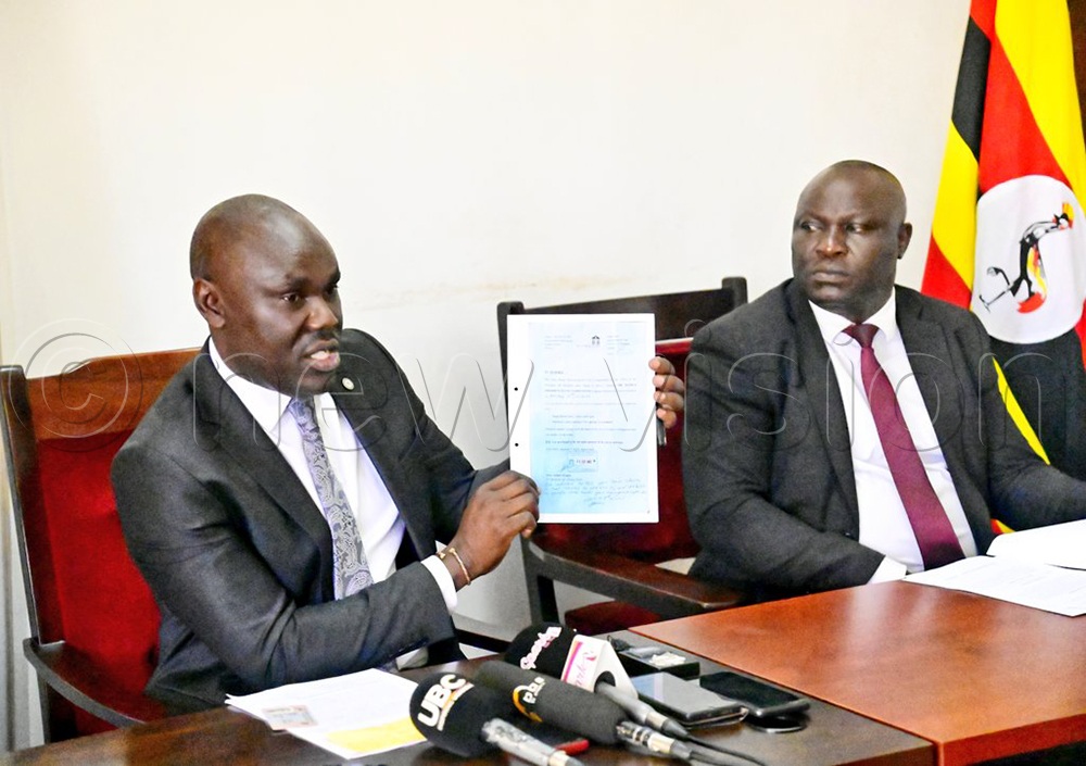 Israel Ochwo, deputy head of SHACU and Fred Lumala, the head of investigations at SHACU offices.