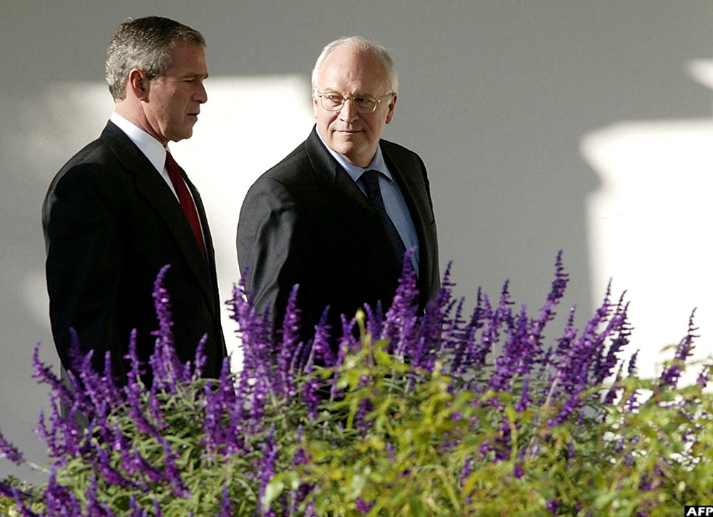 On October 29, 2003, US President George W. Bush walks with Vice-President Dick Cheney along the colonnade at the White House in Washington, DC