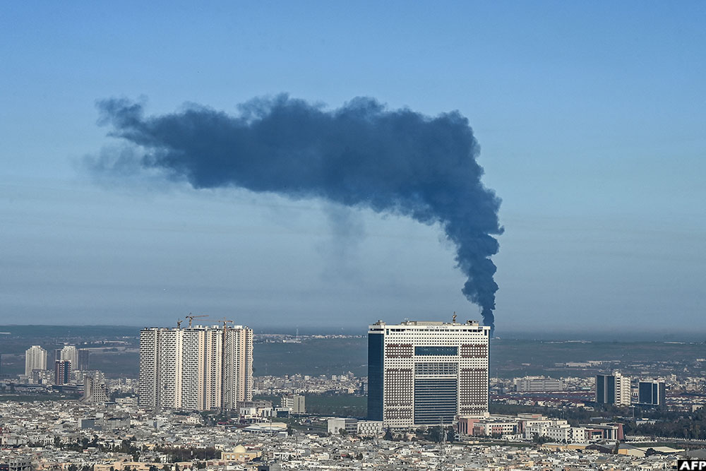 Smoke billows from an oil warehouse in the Kani Qirzhala area on the outskirts of Erbil, the capital of Iraq's autonomous Kurdistan region, following a suspected drone strike, on April 1, 2026. Iraq has been drawn into the broader Middle East war. (AFP)