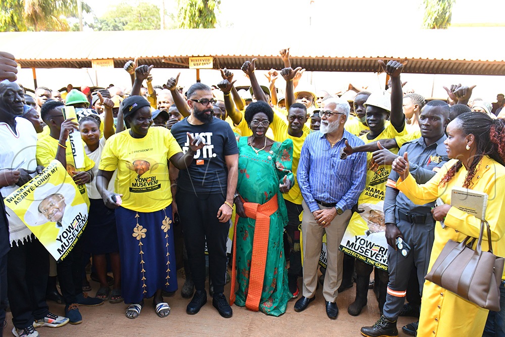  The First Deputy Prime Minister and Minister of East African Community Affairs Rebecca Alitwala Kadaga (middle) in a group photograph with employees of Keshwala Group of Companies led by Ranmal Keshwala (4th right) the Managing Director of Keshwala Group on Saturday in Jinja City. Right is Busoga Kingdom's Minister of Tourism Princess Hellen Namutamba.   (Photo by Donald Kiirya)