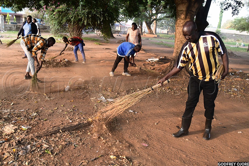 Former state minister of works Musa Ecweru taking part in cleaning Soroti city