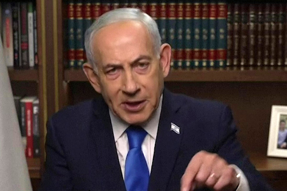This grab from handout video released by Israel's Government Press Office (GPO) shows Prime Minister Benjamin Netnayahu giving a televised address from his office in Jerusalem on February 28, 2026. Netanyahu said on February 28 that Iran must not be allowed to gain nuclear arms urging Israelis to "stand together", in a video message after Israel and the United States launched strikes against the Islamic republic. (AFP)